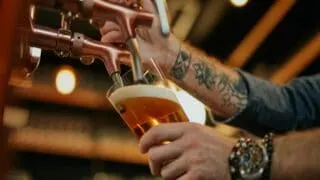 Bartender Pouring a Pint in a Pub